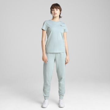 PUMA Tapered Sportbroek 'Ess Elevated' in Groen: voorkant