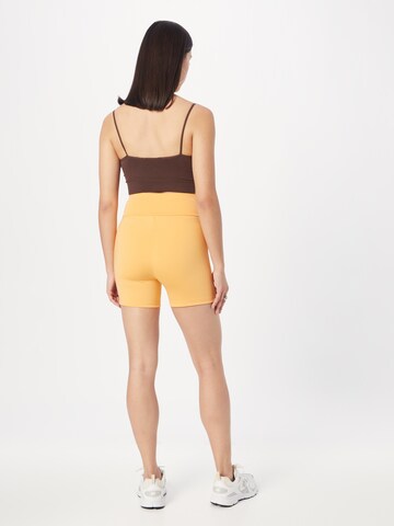 Skinny Pantaloni di Urban Classics in arancione