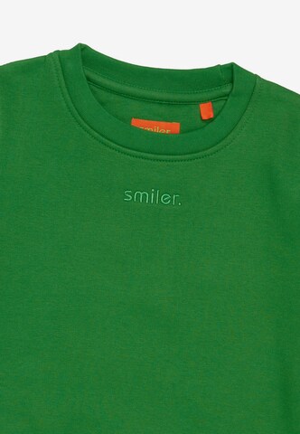 Sweat smiler. en vert