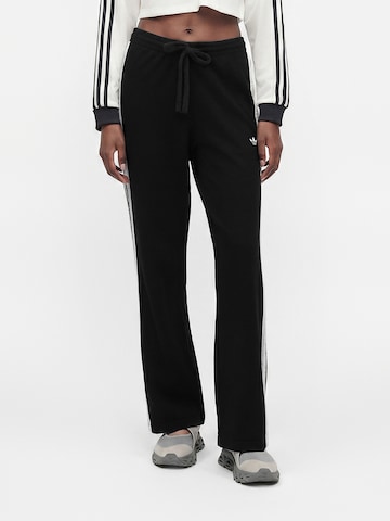 ADIDAS ORIGINALS - Loosefit Calças 'Firebird' em preto: frente