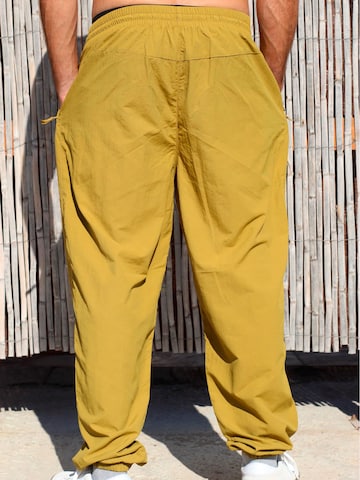Surf Monkey - Loosefit Pantalón funcional en amarillo