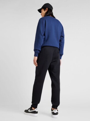 Nike Sportswear Zwężany krój Spodnie 'CLUB' w kolorze czarny