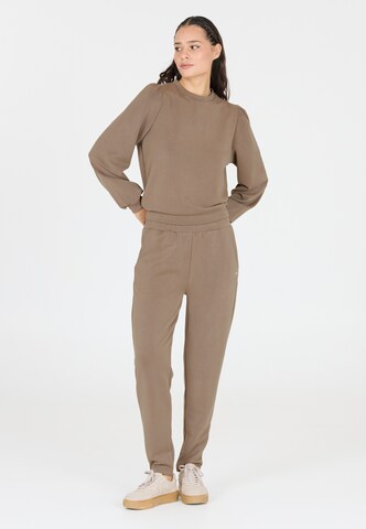 Athlecia Tapered Sportbroek 'Jillnana' in Bruin