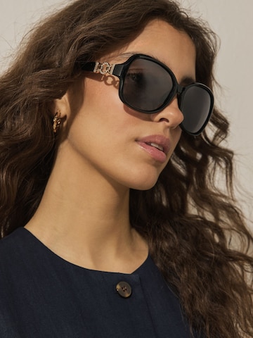 Lunettes de soleil Next en noir