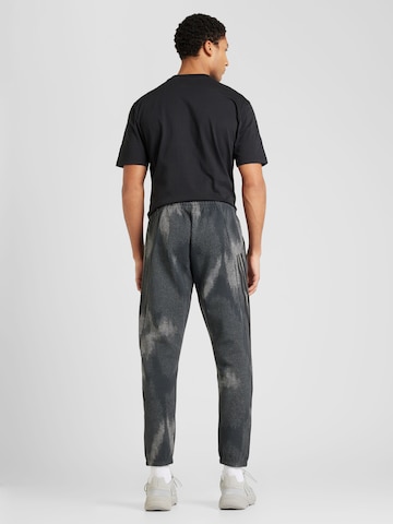ADIDAS SPORTSWEAR Tapered Sports trousers 'Future Icons' in Black