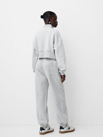 Tapered Pantaloni di Bershka in grigio