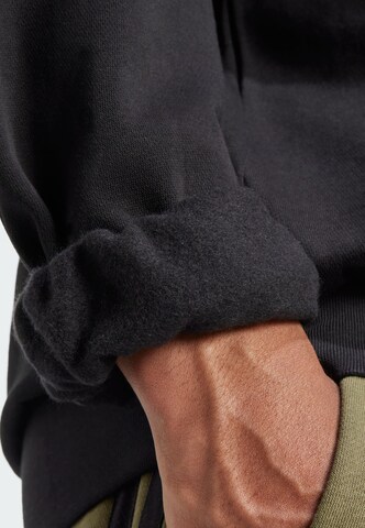 ADIDAS SPORTSWEAR Sports sweatshirt 'Essentials Feelcozy' in Black