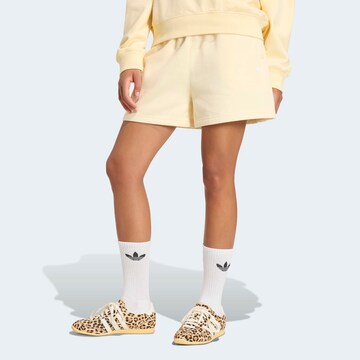 ADIDAS ORIGINALS Loose fit Pants 'Essential' in Yellow: front