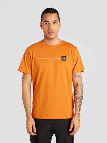 T-Shirt 'NEVER STOP EXPLORING' THE NORTH FACE en marron : devant