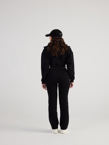 HOLLY LOLLY Regular Trousers in Black
