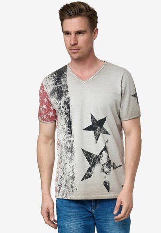 Rusty Neal Cooles T-Shirt mit V-Ausschnitt in Beige: predná strana