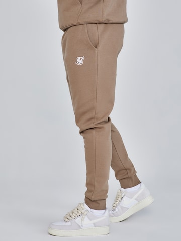 Tapered Pantaloni di SikSilk in marrone
