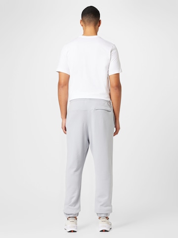 Nike Sportswear Tapered Trousers in Grey