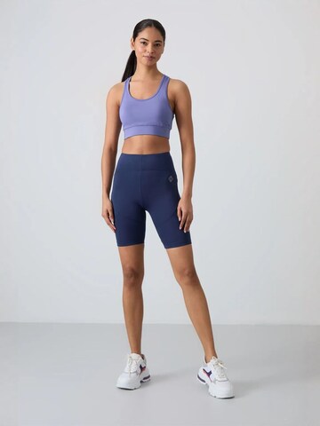 Tommy Life - Tapered Leggings 'Gamaschen' em azul: frente
