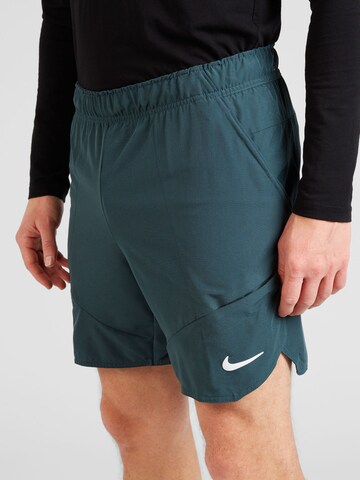 NIKE Regular Workout Pants in Green