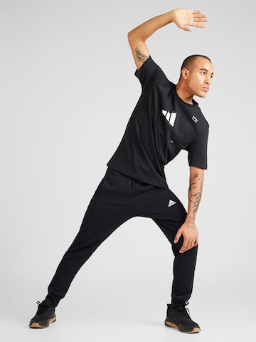 ADIDAS SPORTSWEAR Дънки Tapered Leg Спортен панталон 'Essentials' в черно