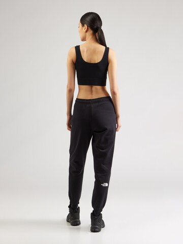 THE NORTH FACE - Tapered Pantalón 'Simple Dome' en negro