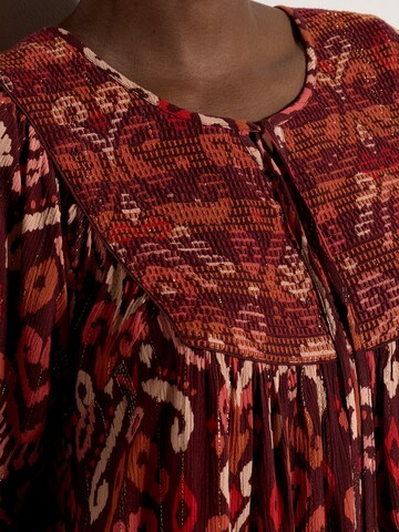 Haut ' ' Apricot en rouge
