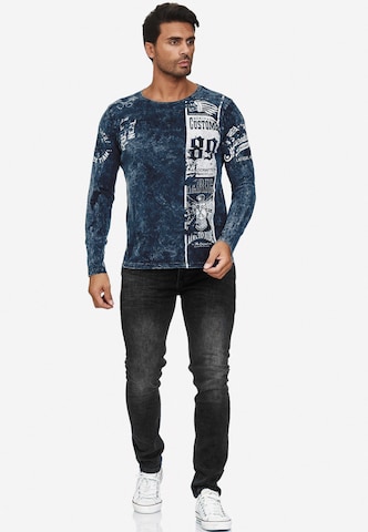 Rusty Neal Langarmshirt mit plakativem Front & Back Print in Blau