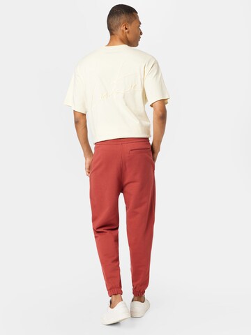 ruda Calvin Klein Jeans Siaurėjantis Kelnės