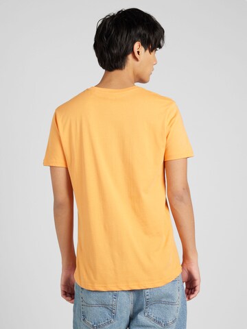 ALPHA INDUSTRIES Regularny krój Koszulka w kolorze pomarańczowy