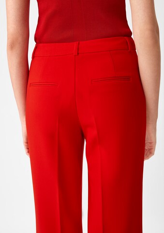 Flared Pantaloni con piega frontale di COMMA in rosso