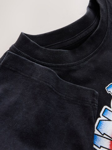 Tricou de la Next pe negru