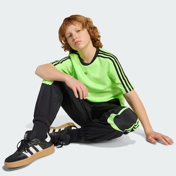 ADIDAS ORIGINALS Loose fit Trousers 'Teamgeist' in Black