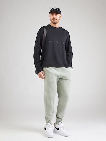 Nike Sportswear Tapered Byxa 'CLUB' i grön