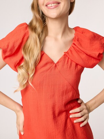 Quiosque Cocktail dress in Orange