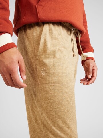 NIKE Tapered Sports trousers in Green
