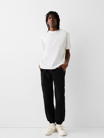 Bershka Tapered Cargo nadrágok - fekete