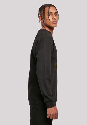 F4NT4STIC Sweatshirt 'Looney Tunes Group Faux Pocket' in Black