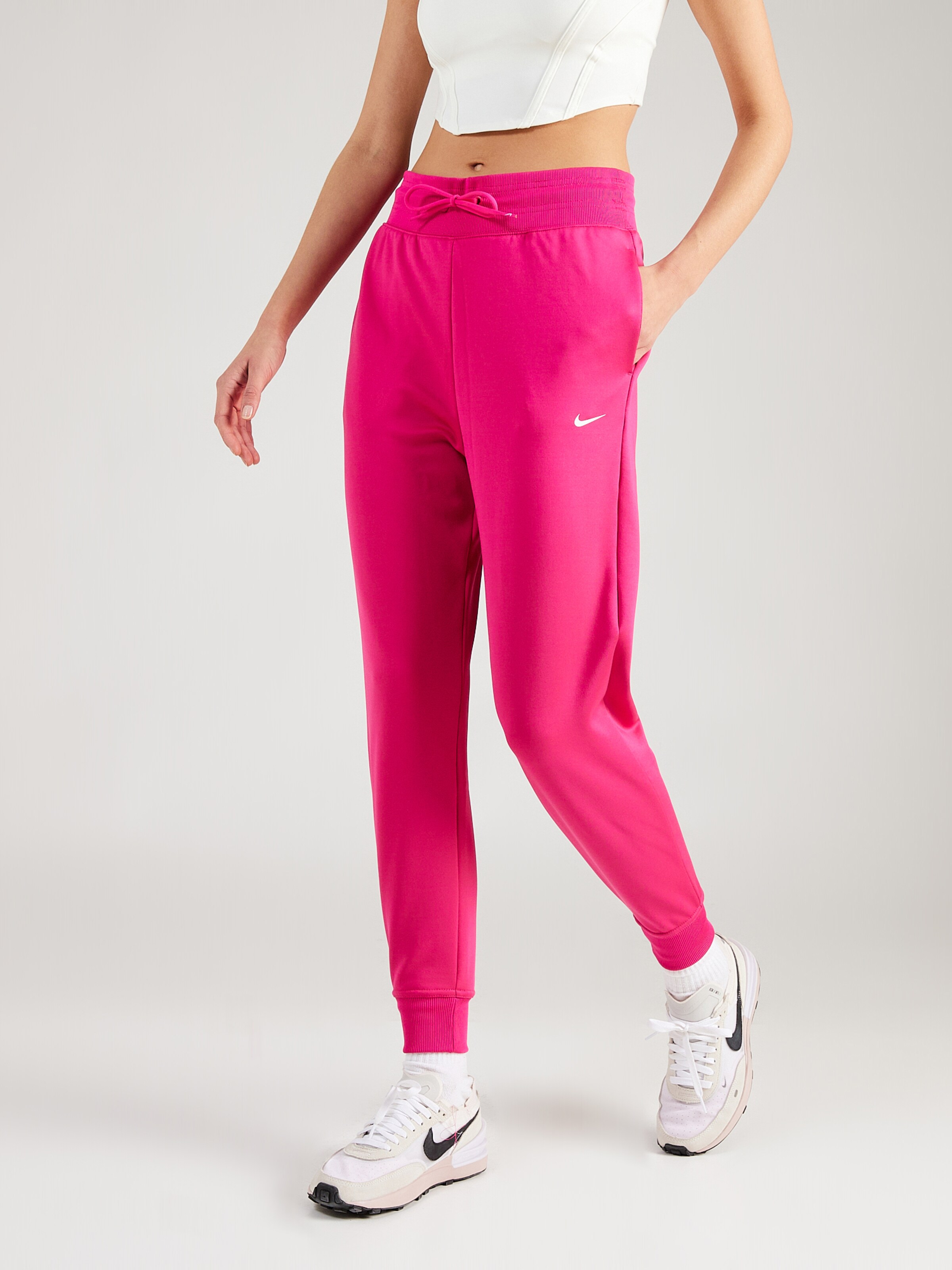 NIKE Tapered Sports trousers ONE in Red Violet ABOUT YOU