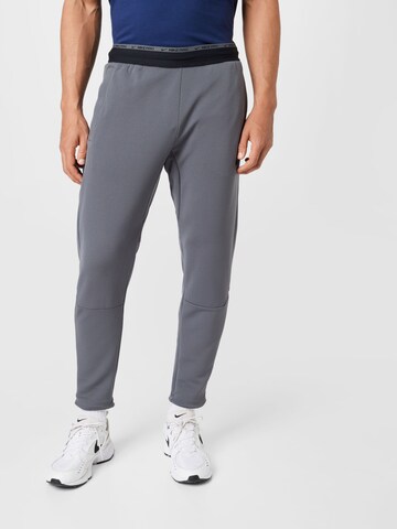 NIKE Regular Workout Pants in Grey: front