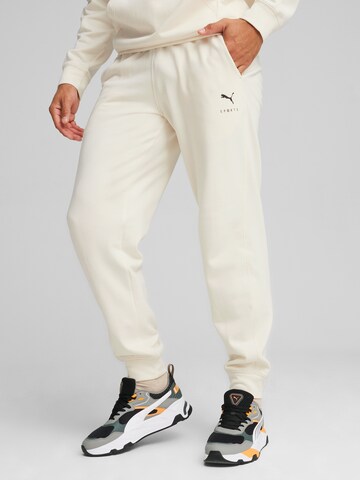 PUMA Tapered Sports trousers in Beige: front