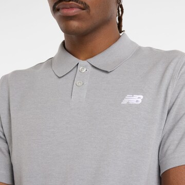 new balance Poloshirt in Grau