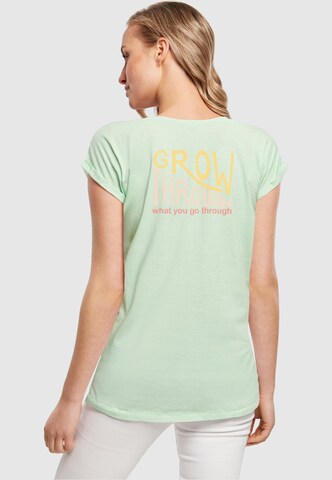 Merchcode Shirt 'Spring - Grow through 1' in Groen: voorkant