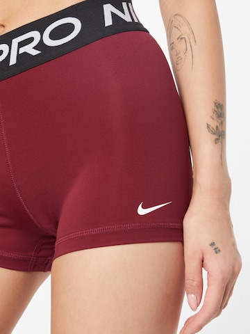 NIKE Skinny Workout Pants 'Pro' in Red