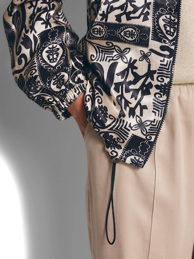 Goldner Tussenjas in de kleur Ivoor / Zwart, Productweergave