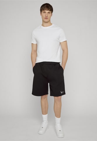 Karl Kani Regular Trousers in Black: front