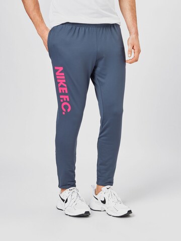 NIKE Slim fit Workout Pants in Blue: front