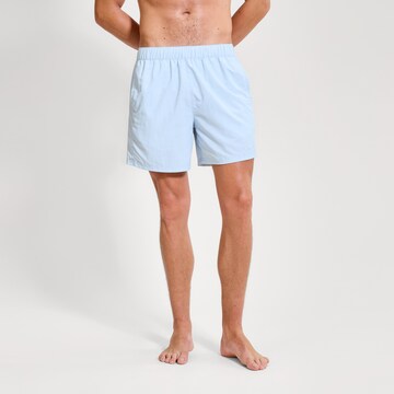 ELLESSE Board Shorts in Blue: front