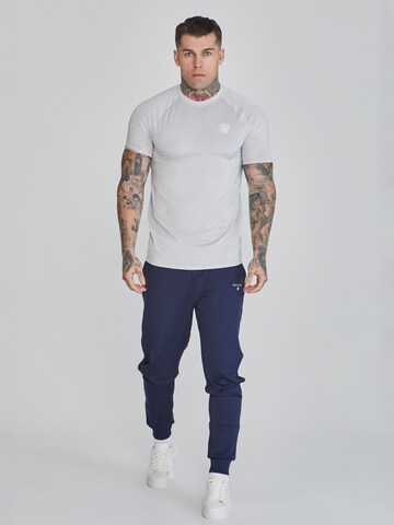 Tapered Pantaloni sportivi di SikSilk in blu
