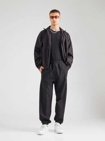 Calvin Klein Jeans Tapered Hose in Schwarz