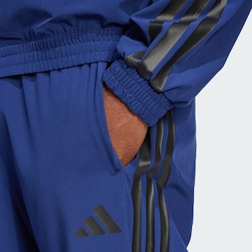 ADIDAS SPORTSWEAR Конический (Tapered) Спортивные штаны 'House of Tiro' в Синий