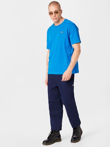 Tapered Pantaloni sportivi di Lacoste Sport in blu