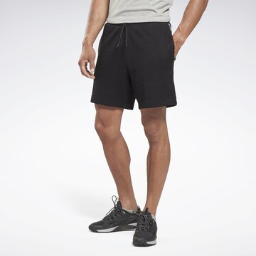 Regular Pantalon de sport 'Vector' Reebok en noir : devant