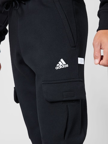 ADIDAS SPORTSWEAR Tapered Sports trousers 'Future Icons Fleece ' in Black