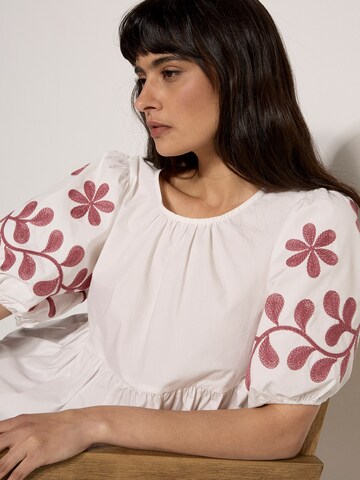 Apricot Floral Embroidered Peplum Top ' ' in Beige